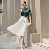 Silk pleated midi skirt with high-waisted fit for a flowy and elegant daytime silhouette